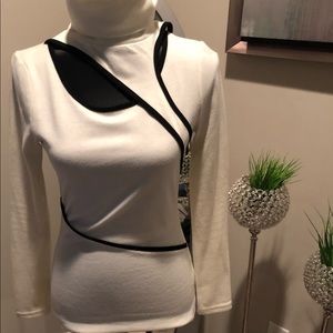White cut out turtle neck.